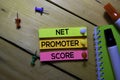 Net Promoter Score - NPS text on sticky notes isolated on office desk