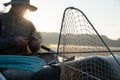 Net for pulling fish out of the water in an inflatable boat, against a blurred background, a fisherman prepares for Royalty Free Stock Photo