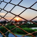 Chainlink fence and sunset Royalty Free Stock Photo