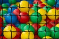 Net with various colorful plastic balls for play of kids Royalty Free Stock Photo