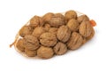 Net with whole walnuts in the shell on white background close up Royalty Free Stock Photo