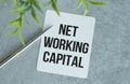 Net Working Capital write on paper on Gray Table. Business or Financial Concept. Royalty Free Stock Photo