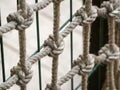 The net is woven with a strong rope. Large, strong knots hold the ropes together. Diagonal background Royalty Free Stock Photo