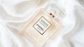 Netanya, Israel - 27 January, 2023 Coco Mademoiselle Chanel Paris worldwide famous French perfume bottle on the white silk