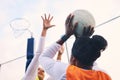 Netball, goal shooter and fitness of a girl athlete group on an outdoor sports court. Aim, sport game and match