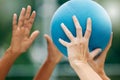 Netball, sport and athlete hands with ball, game and challenge on a court in urban city park outside. Women, sports