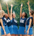 Netball, sports and motivation with a woman team in celebration after victory in a competitive game on a court. Fitness