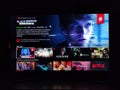 Netflix app on tv screen playing and the `Black Mirror Bandersnatch ` series logo behind.