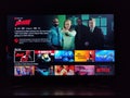 Netflix app on tv screen playing and the `Daredevil` series logo behind.