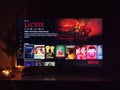 Netflix app on tv screen playing and the `Lucifer` series logo behind