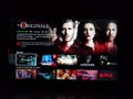 Netflix app on tv screen playing and the `The Originals ` series logo behind. Royalty Free Stock Photo