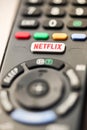 Netflix button on a TV remote control in selective focus