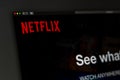 Netflix company website homepage. Close up of Netflix logo