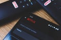 Netflix login on smartphone display. New password sharing rules on Netflix