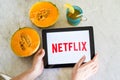 Netflix logo shown on a smart phone screen with fresh fruit