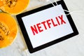 Netflix logo shown on tablet screen with fresh fruit Royalty Free Stock Photo