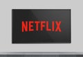 Netflix logo on TV. Screen TV displaying logo of Netflix.