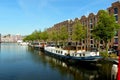 Netherlands, Amsterdam, 249 Nieuwe Herengracht, canal, boats and houses along the waterfront Royalty Free Stock Photo