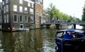 Netherlands, Amsterdam, 4 Oudezijds Voorburgwal, view of the canal, Armbrug and houses on the waterfront Royalty Free Stock Photo