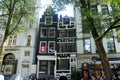 Netherlands, Amsterdam, 13 Spui, black three-story house between two white