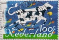 NETHERLANDS - CIRCA 1995: a postage stamp printed in the Netherlands showing the painting of a black and white spotted cow, wooden