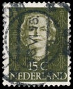 NETHERLANDS - CIRCA 1949: A stamp printed in Netherlands, shows portrait of Queen Juliana, monogram and a crown without