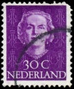 NETHERLANDS - CIRCA 1949: A stamp printed in Netherlands, shows portrait of Queen Juliana, monogram and a crown without