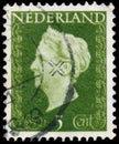 Stamp printed in Netherlands shows portrait of Queen Wilhelmina - Queen regnant of Netherlands Kingdom Royalty Free Stock Photo