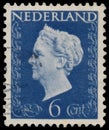 Stamp printed in Netherlands shows portrait of Queen Wilhelmina - Queen regnant of Netherlands Kingdom Royalty Free Stock Photo