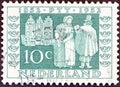 NETHERLANDS - CIRCA 1952: A stamp printed in the Netherlands shows Postman delivering letters, 1852, circa 1952.