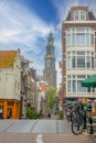 Narrow Street and the Dome of the Ancient Cathedral in Amsterdam Royalty Free Stock Photo