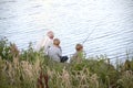 Grandpa teaches grandchildren fishing