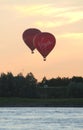 Balloon in the air above the river Waal