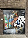 Graffiti on a steel door of a former craft school in Leiden, Netherlands.