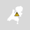 Netherlands map with caution sign.