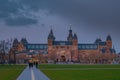 Amsterdam at summer night. Famous national Rijks museum general view at dusk