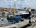 Docked fishing boats in the port of Scheveningen.