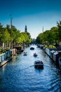 Netherlands, South Holland, Hampshire Inn - Prinsengracht, CANAL AMIDST BUILDINGS AGAINST CLEAR SKY