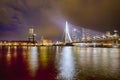 Netherlands Travel Concepts. Tranquil Night View of Renowned Erasmusbrug Swan Bridge in Rotterdam in Front of Port with Harbour