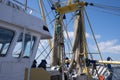 Nets from a Dutch fishing trawler hang to dry on a steel structure on the deck Royalty Free Stock Photo