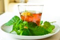 Nettle infusion with nettle leaves in a transparent cup