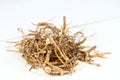 Dried nettle roots, Urtica diocica, on white background