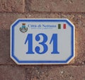 Nettuno, Lazio, Italy - Sep 17, 2019: Ceramic plate with house number