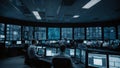 Network administrators monitoring a control room full of screens