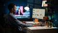 Network analyst studying digital commerce progression reports on computer