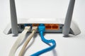 Network cable connects to wireless router, router, internet, global network. Royalty Free Stock Photo