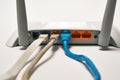 Network cable connects to wireless router, router, internet, global network. Royalty Free Stock Photo