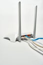 Network cable connects to wireless router, router, internet, global network. Royalty Free Stock Photo