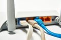 Network cable connects to wireless router, router, internet, global network. Royalty Free Stock Photo