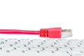 Network cable on keyboard Royalty Free Stock Photo